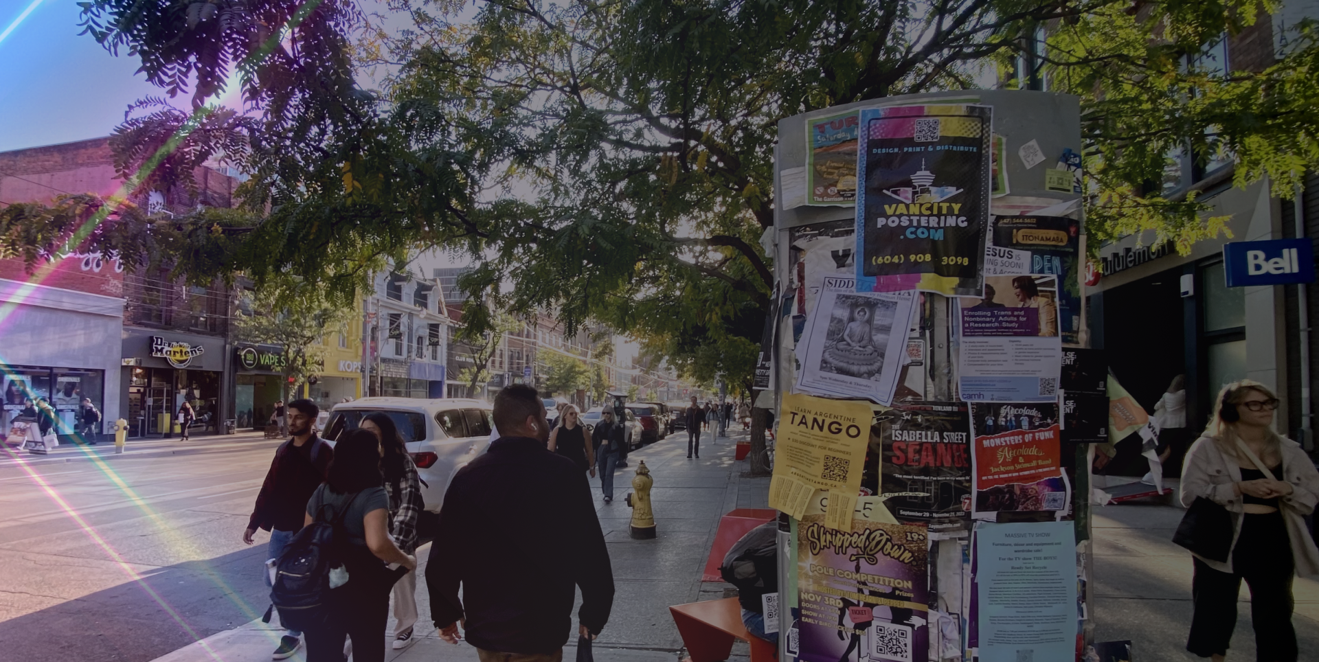 Busy postering board in Toronto - distribution by Skyline City Media