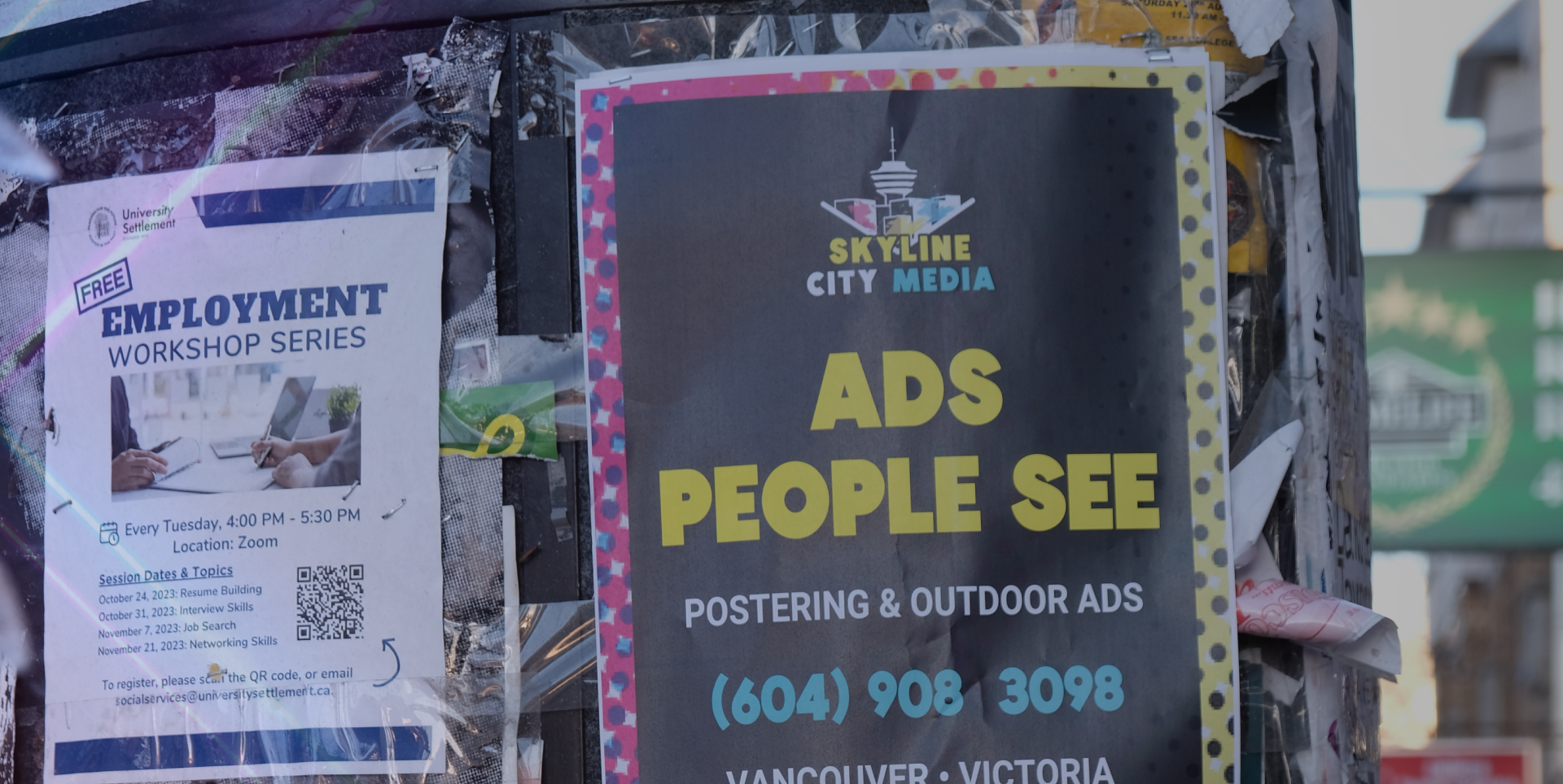 Skyline City Media's poster advertising solutions - shown on a downtown Toronto postering board.