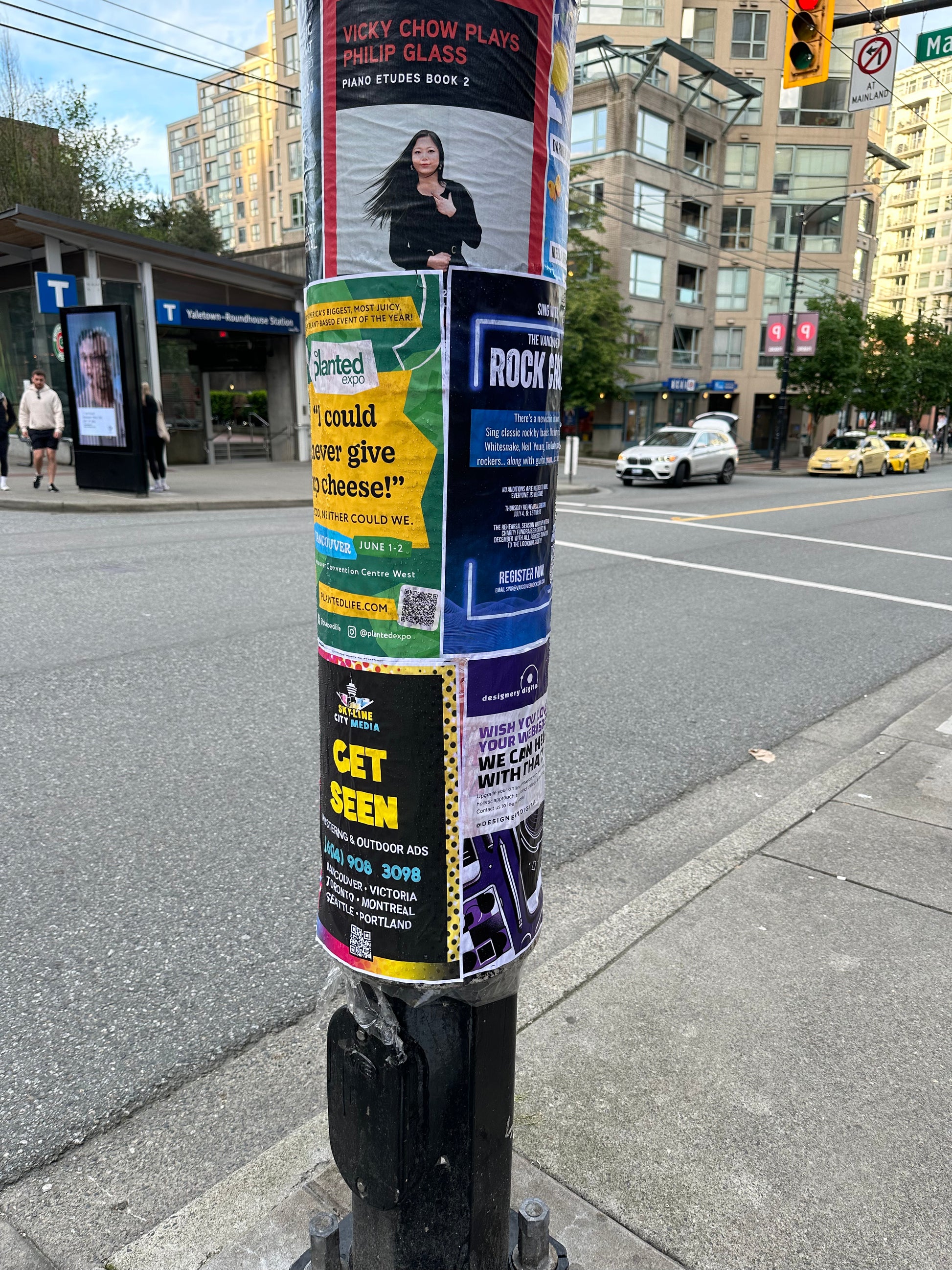 Posters on a pole on the street from Skyline City Media