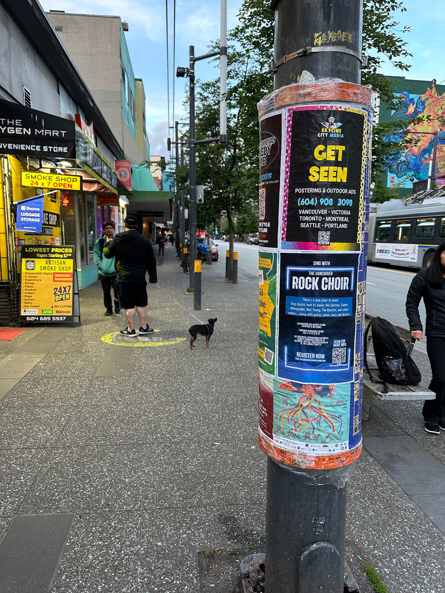 Posters put up on a city cylinder in downtown Vancouver by Skyline City Media