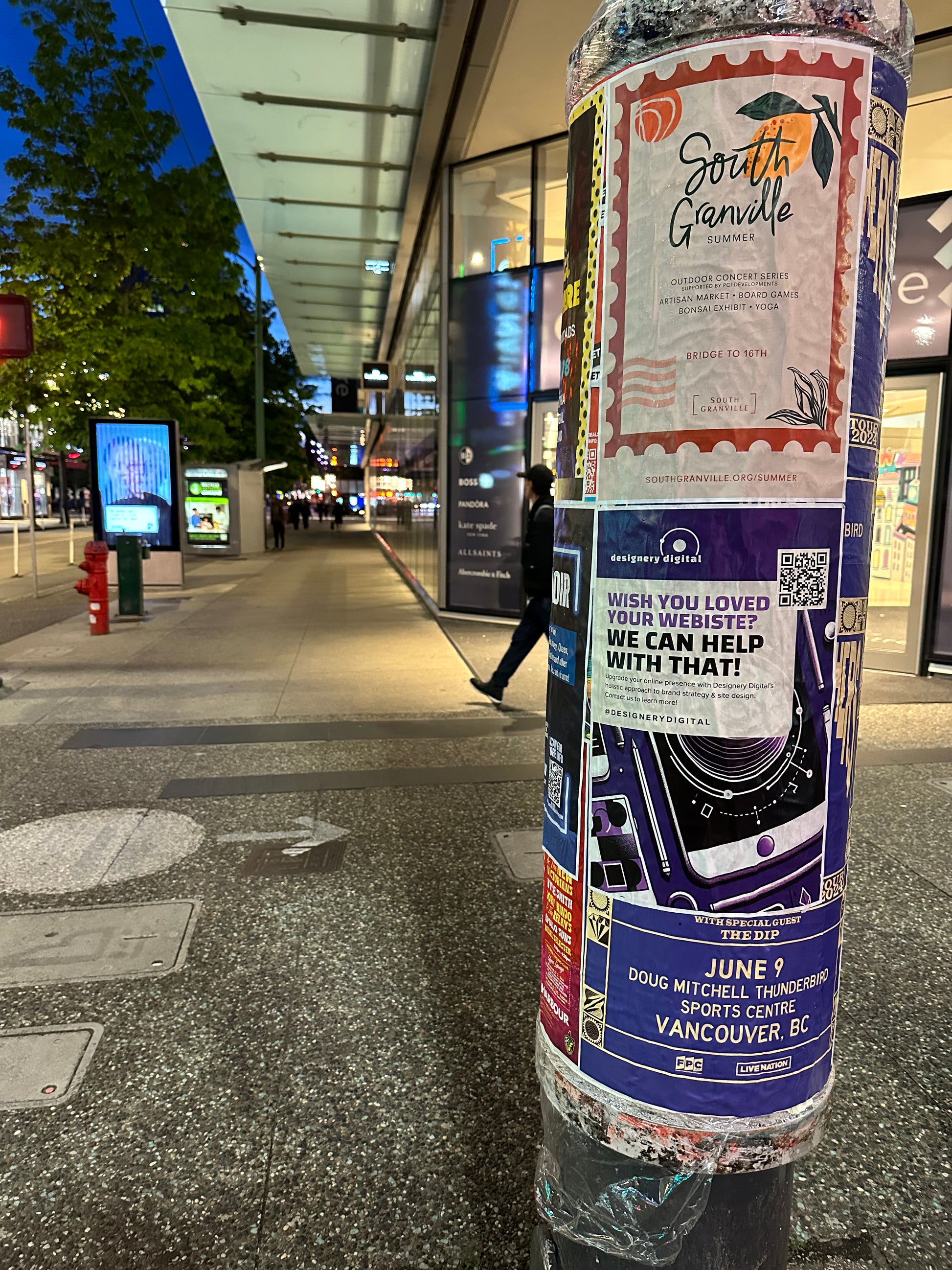 Posters next to a bus stop from Skyline City Media for a vancouver postering campaign