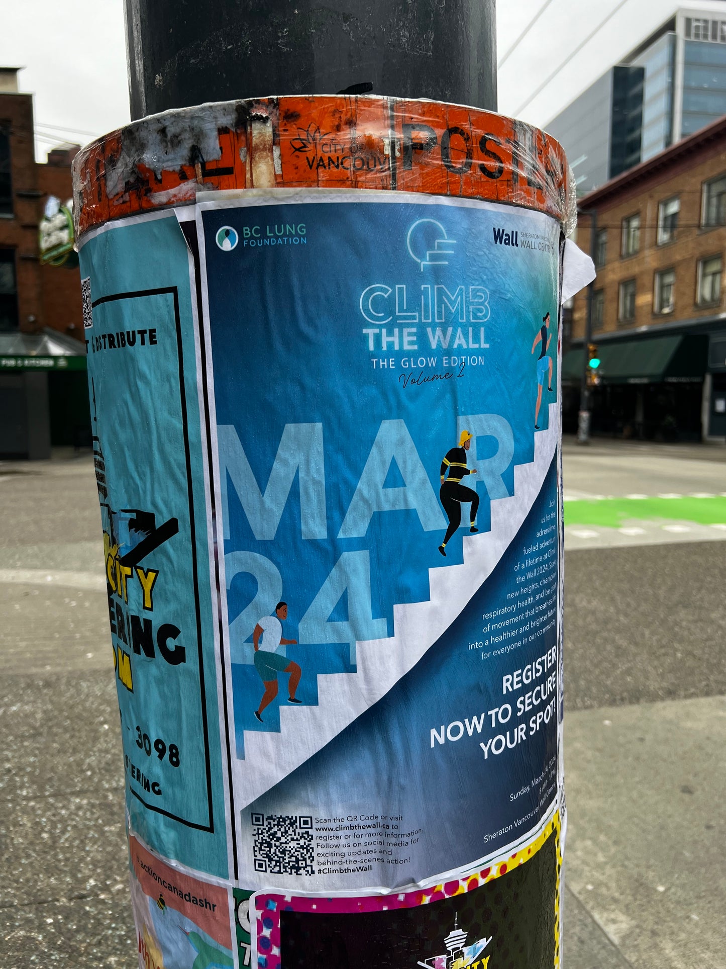 Posters distributed on a postering city cylinder in Downtown Vancouver by Skyline City Media