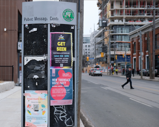 Posters on a public message board in Toronto - one of Skyline City Media's advertising solutions 